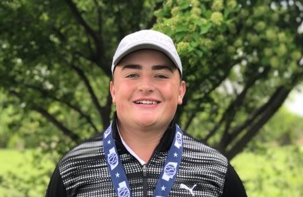 Luke Gutschewski '21 poses with his medal after winning the individual Class B state golf championship. Gutschewski was the first Knight ever to win the golf championship.