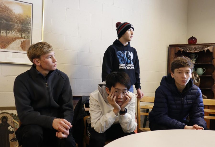 Peyton Rosenfels 20, Scott Ding 21, Skyler Davis 19, and Issac Gart 19 wait for further instructions during a break out session held at the Abbey. Students rotated between three sessions during the day.