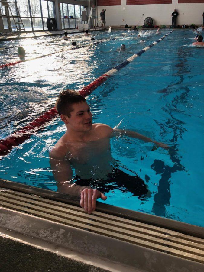 Max Swiniarski 20 waits to swim down the lane. Every school day, the Mount Michael swim team practices at the Montclair Community Center.