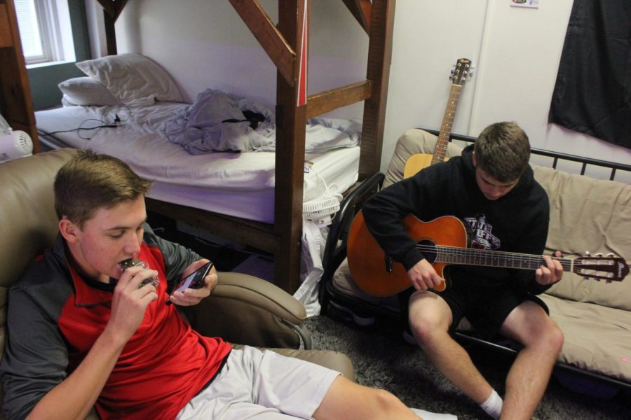 Logan+Hock+20+hangs+out+in+the+dorms+while+listening+to+Ben+deMayo+20+playing+the+guitar.+With+fall+sports+ending%2C+students+have+much+more+time+to+relax.