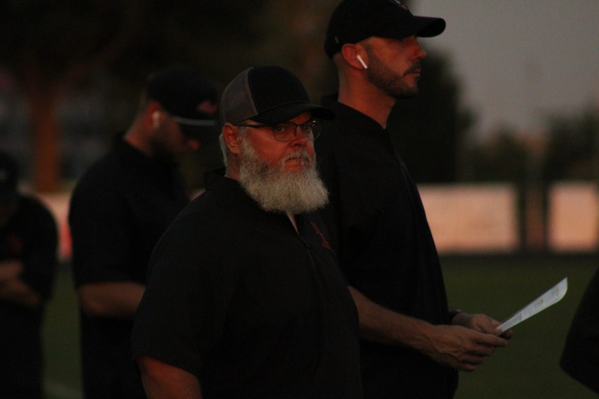 Looking Out for the Linemen Coach Baker watches the team play  against Colombus Lakeview. The Knights fell 14-24